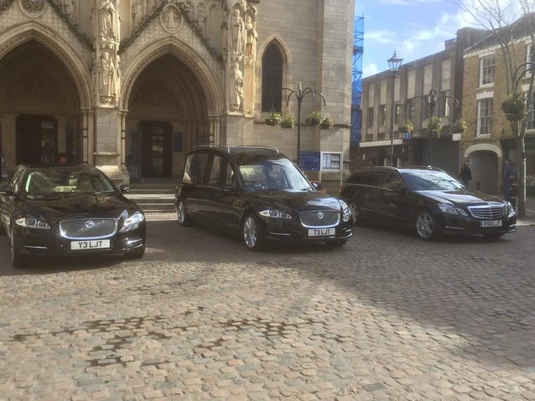 Hearse and limousines lined up outside Truro Cathedral